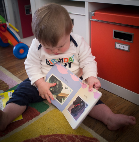 Opening his new book -- tearing off the wrapping paper