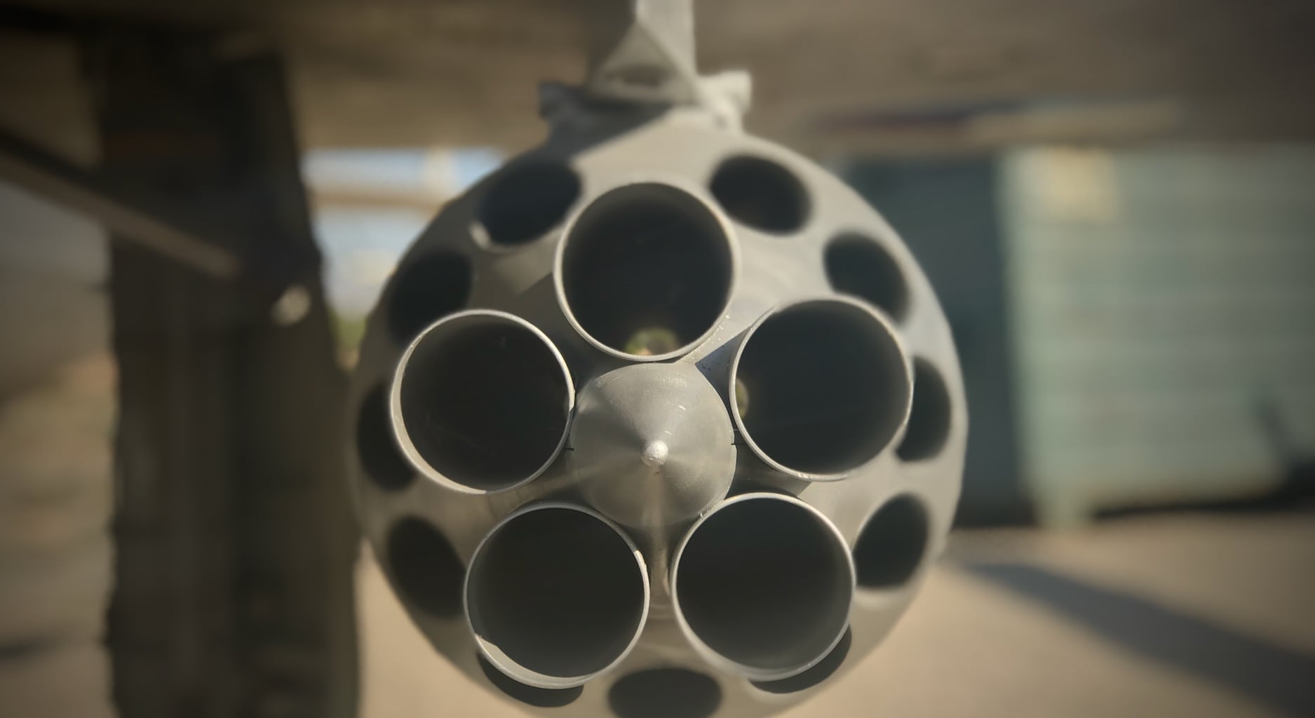 A Russian rocket pod for fighters, looked at head-on, showing 16 empty holes for rockets
